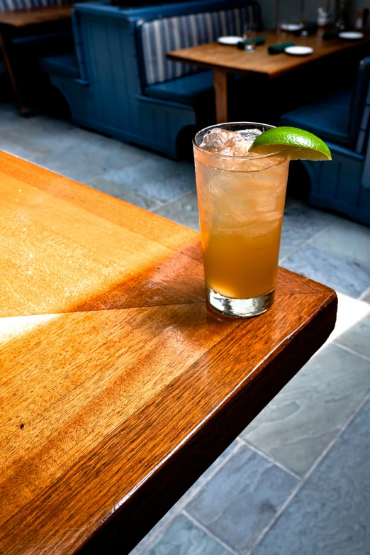 a cocktail that is on a table in a restaurant