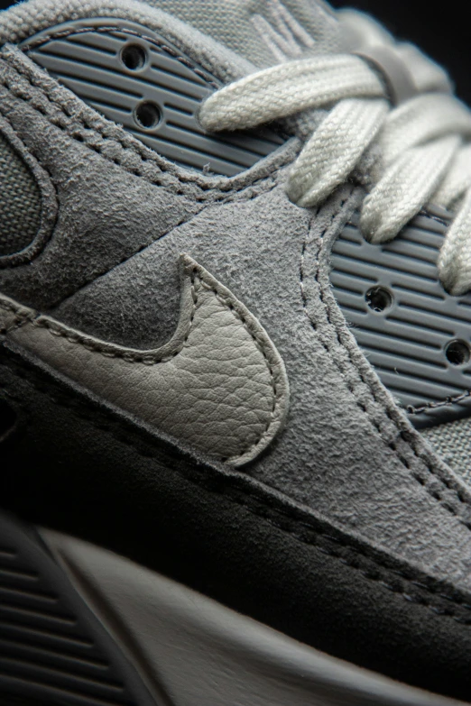 a close up of the laces on a grey sneakers