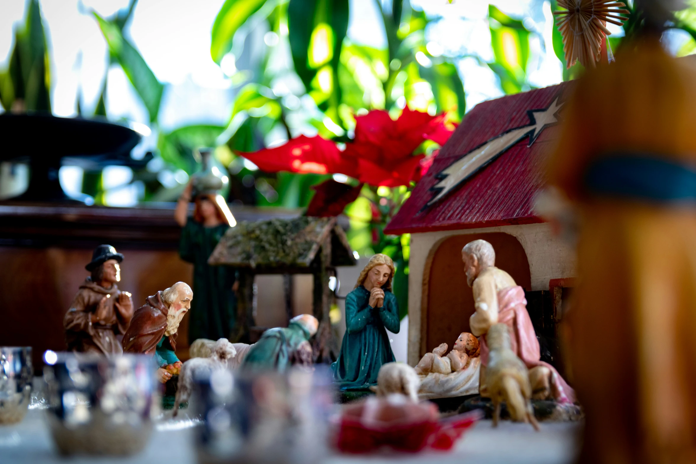 figurines of two women and three children with flowers