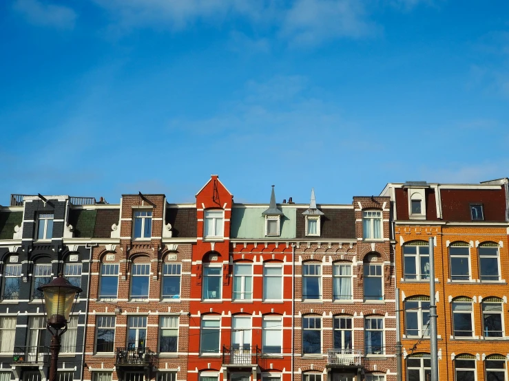 a group of colorful browns and browns buildings in a large city