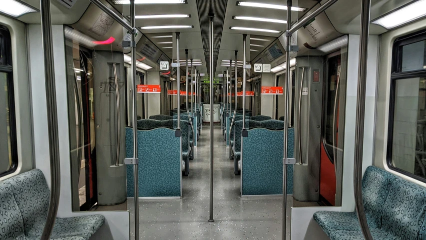 seats in a subway car inside an empty area