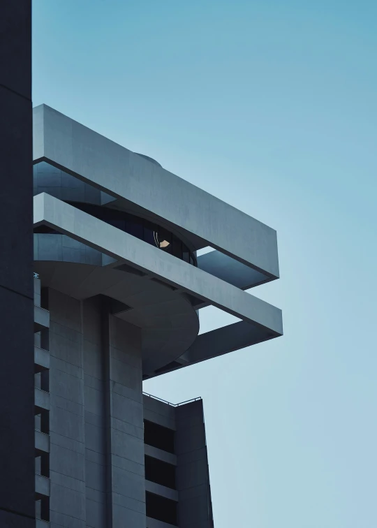 a white bird is sitting on top of the roof of a building