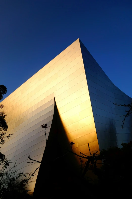 the exterior of an art museum at dusk