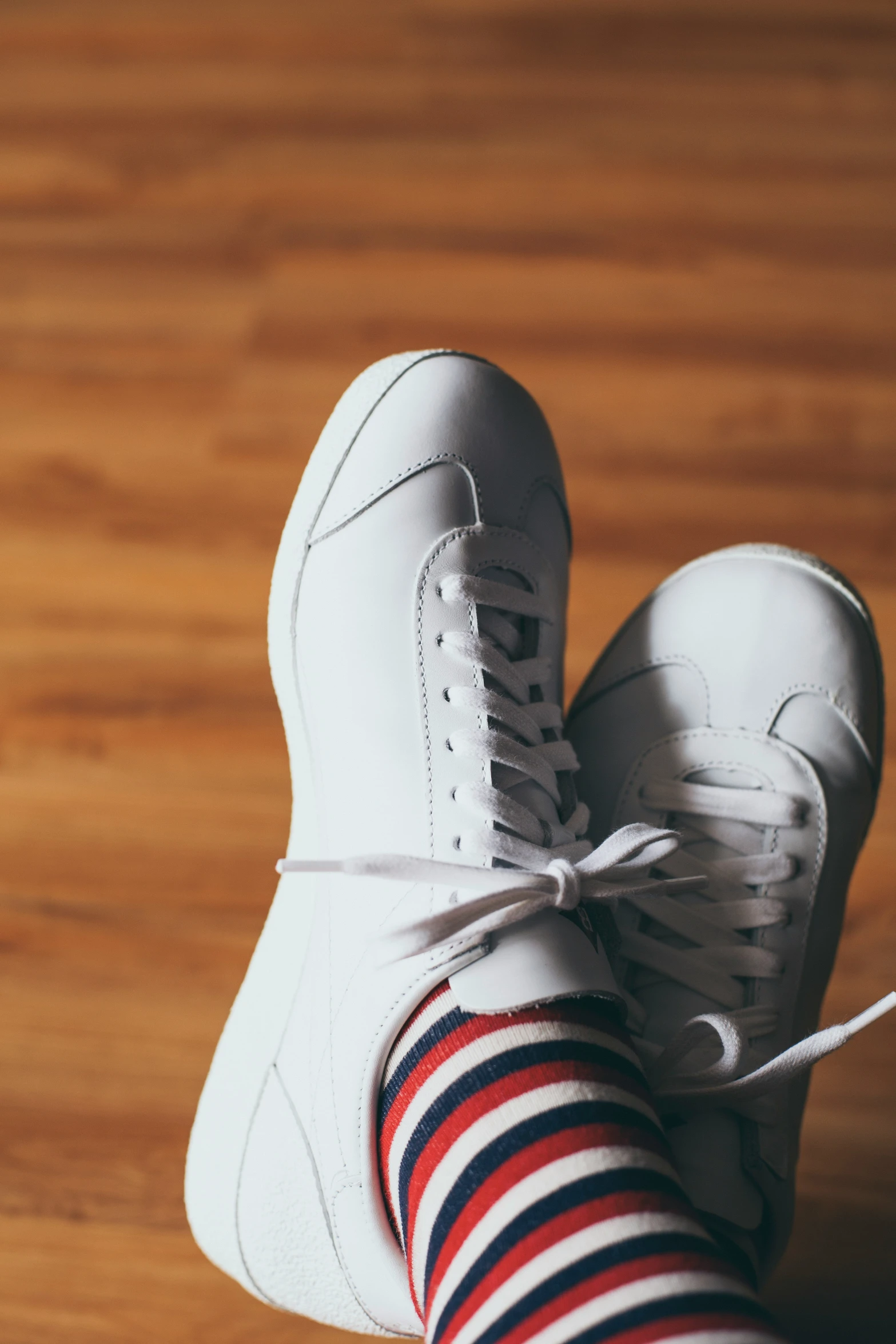 close - up of a person's feet in striped socks