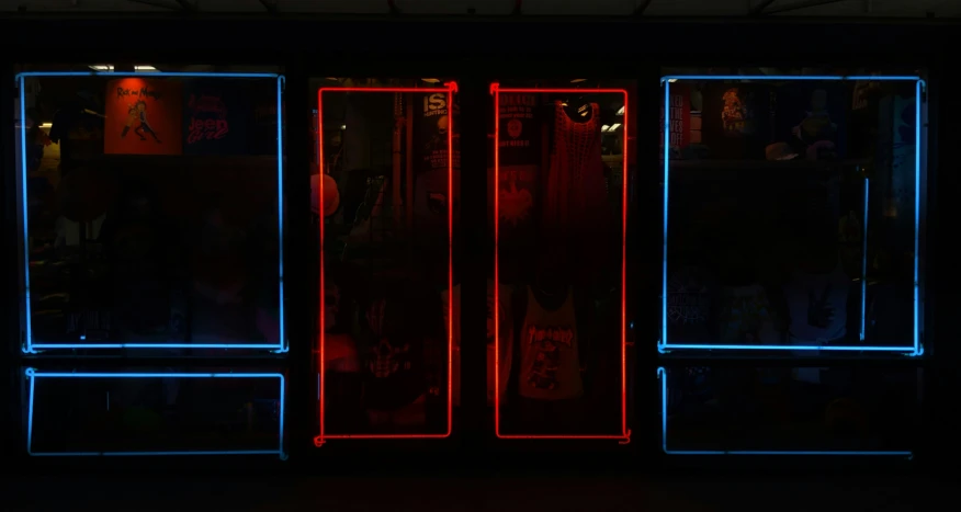 three empty blue and red lighted vending machines