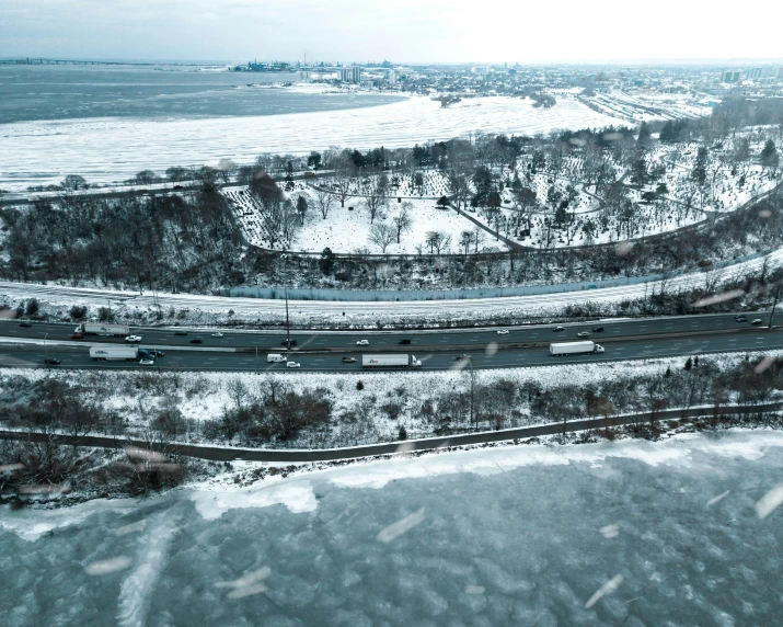 an overhead view of a winter street and the ocean