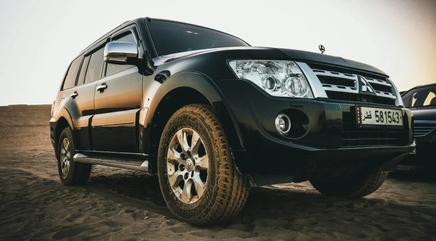 a toyota truck is parked on the sand