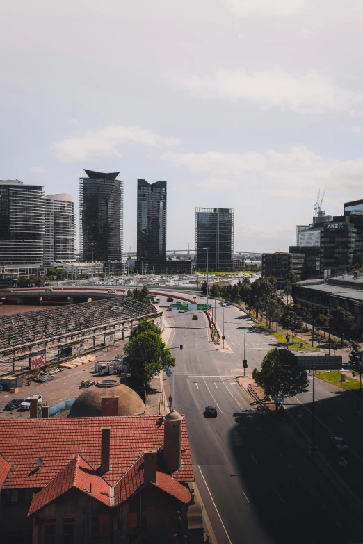 an overhead view of a city street lined with parked cars