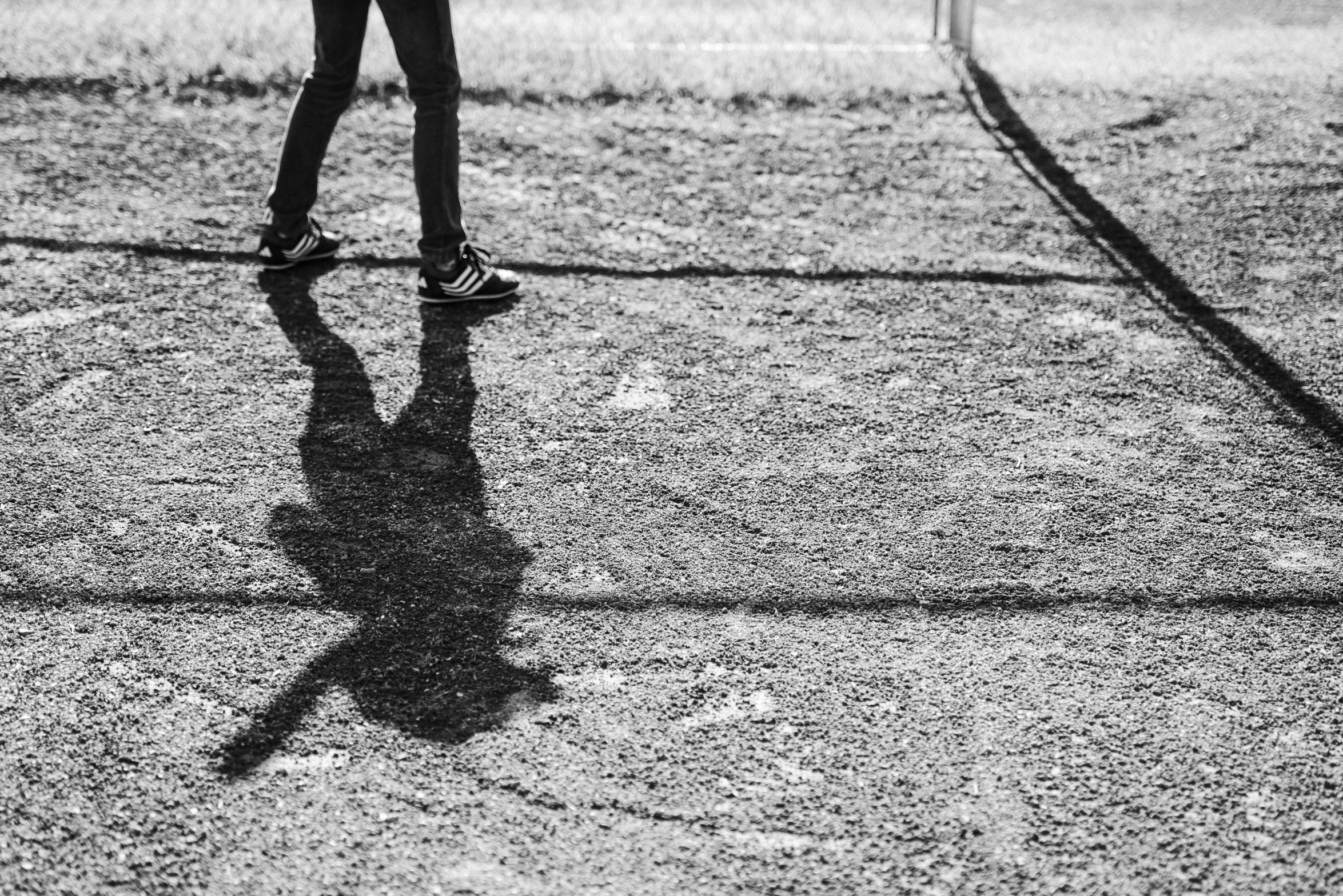 a person standing next to a soccer ball