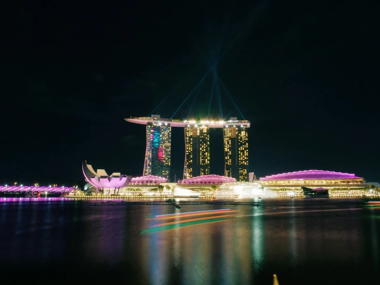 the lights are lit up at night in singapore