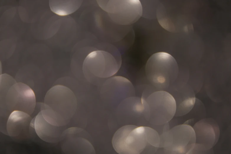 a blurry picture of several light colored dots