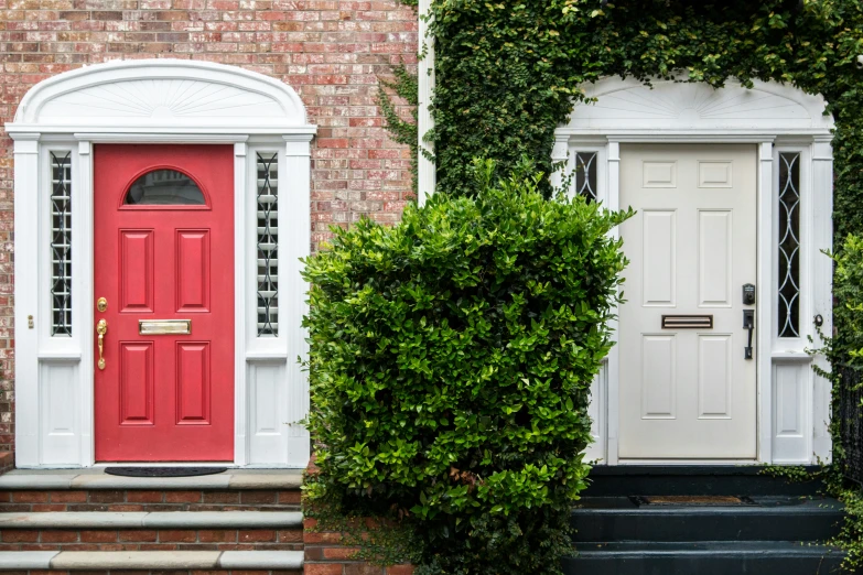 a set of steps leading to two doors with the same one in front