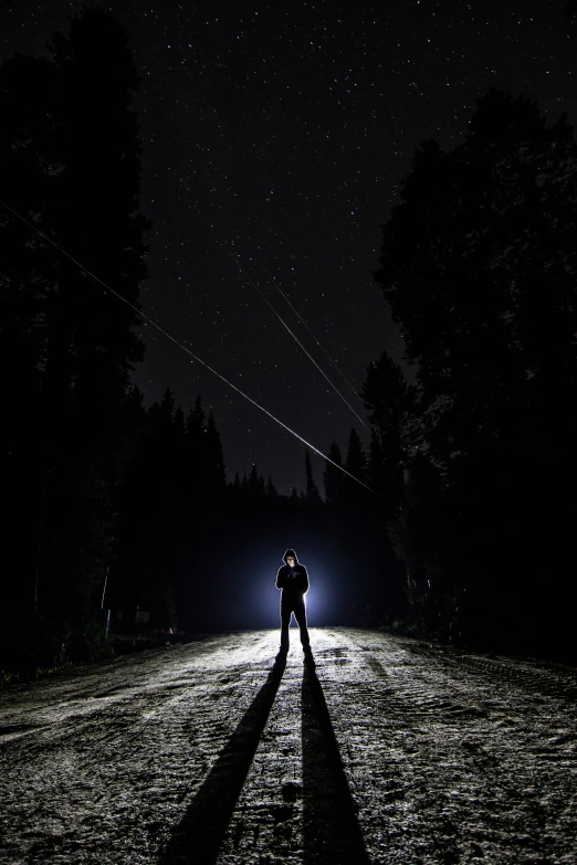 two people stand in the distance as they hold hands