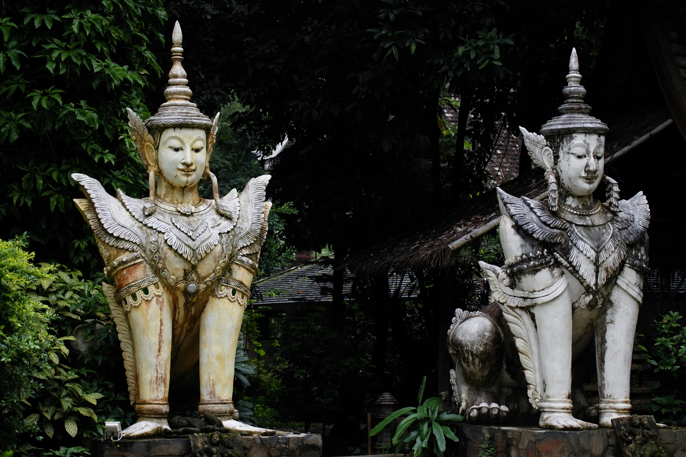 a couple of statues of some sort sitting next to each other