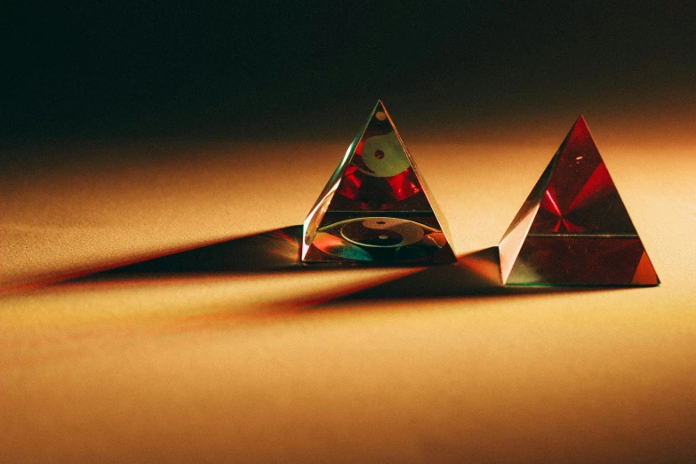 two triangles that have been made from metallic