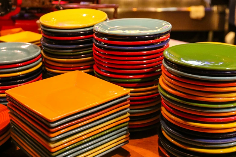 a close up s of plates stacked high and dry