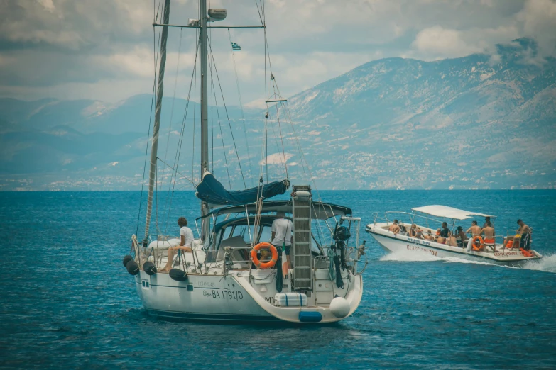 a large white boat is next to another small boat