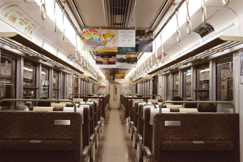 inside of a subway train car with seats and windows