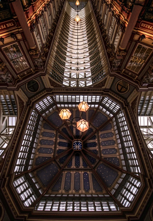 the roof of an office building that has many windows and lights