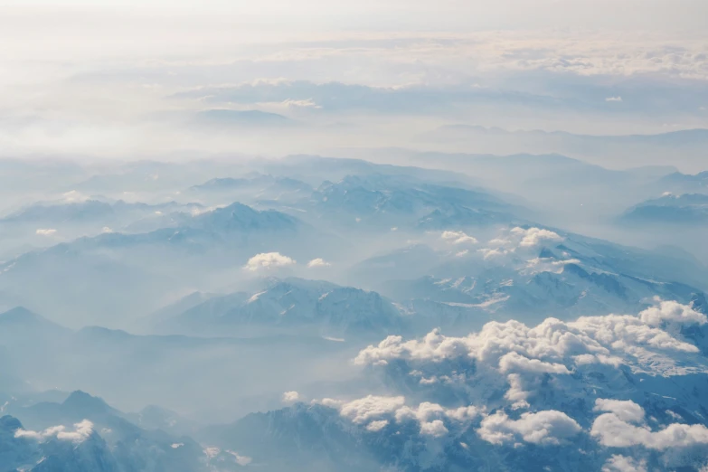 a very large airplane with a lot of clouds above it