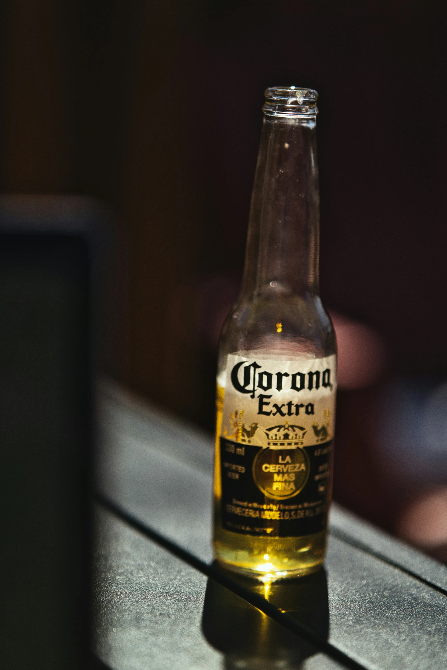 a small beer bottle sits on top of a table