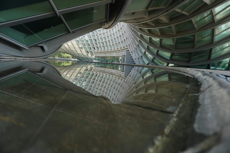 an architecture view of an outdoor mall with glass buildings