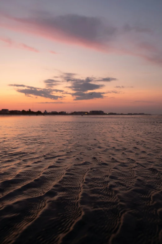 a view of the water and land from the beach