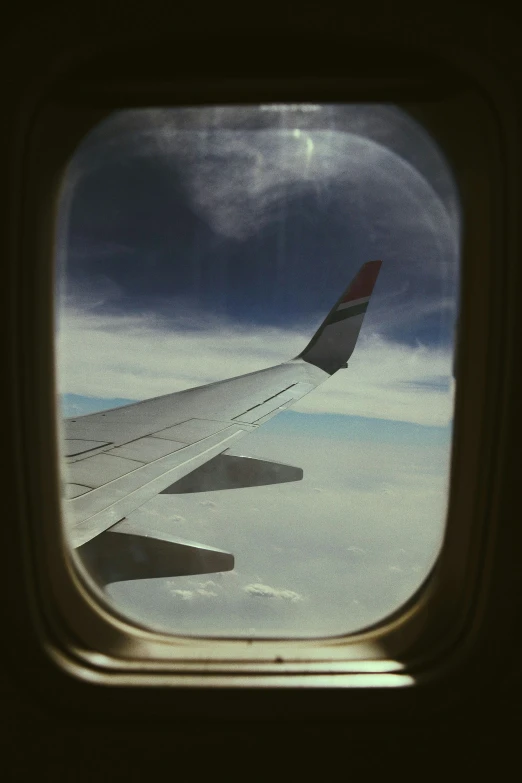 a view of the wing of an airplane