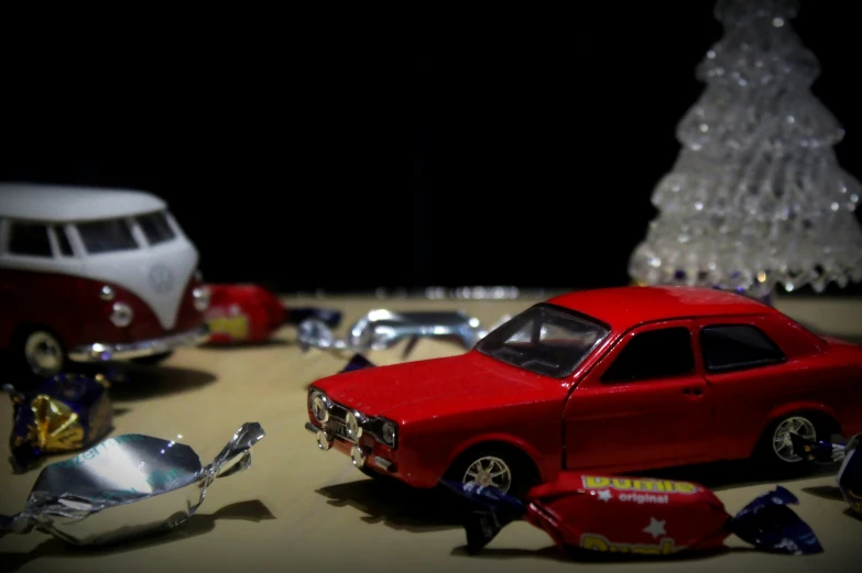 a toy car is surrounded by other model cars