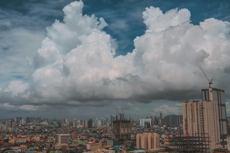 some buildings clouds and sky and a blue cloudy sky