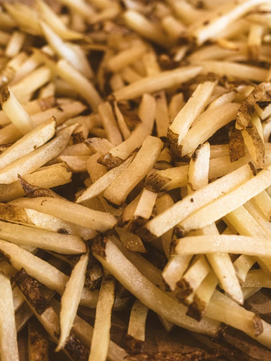 the large pile of fries is made from cooked and cut up food