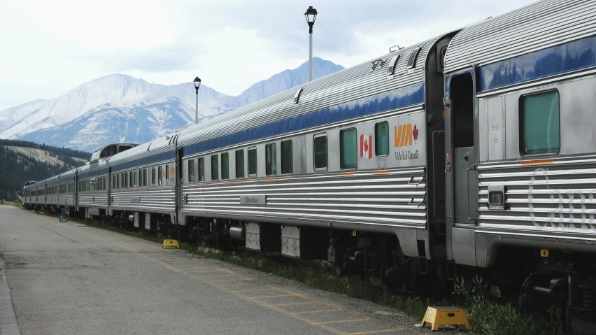 an old passenger train parked on the tracks