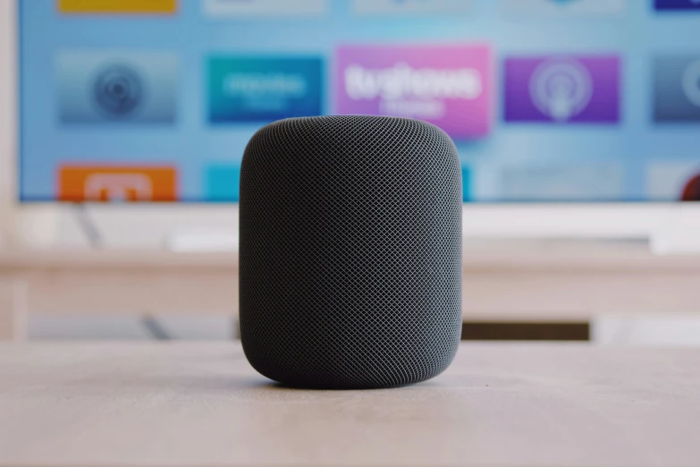 an apple home speaker sitting on a table