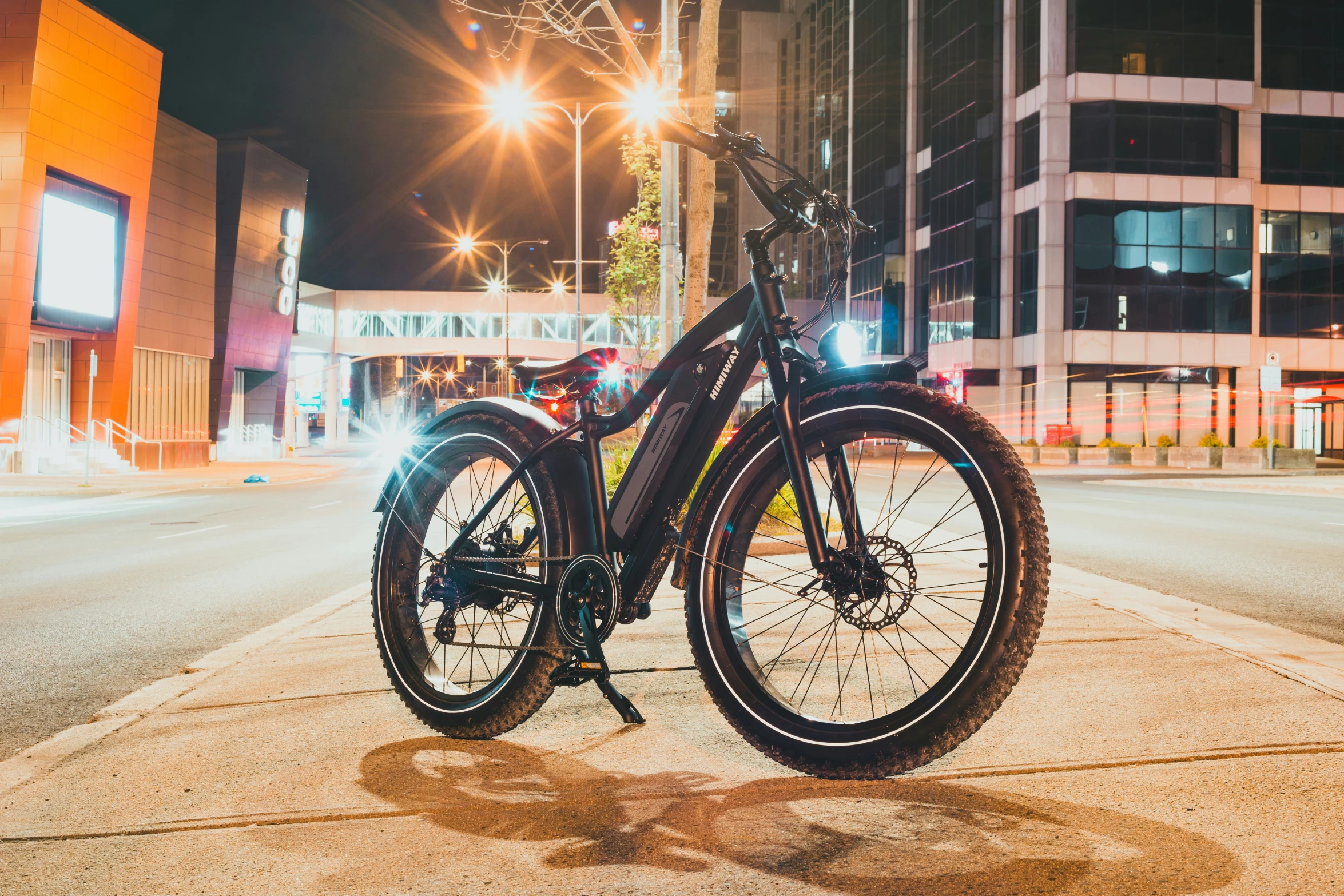 a bicycle parked on the street at night