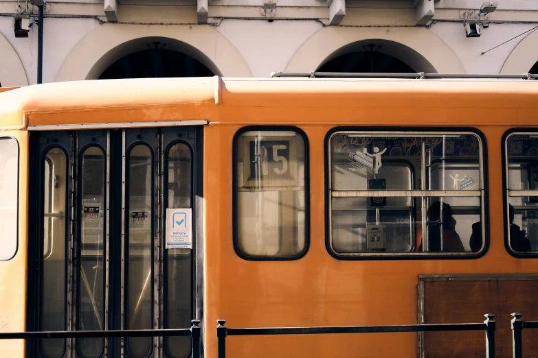 the doors and windows are open on a yellow bus