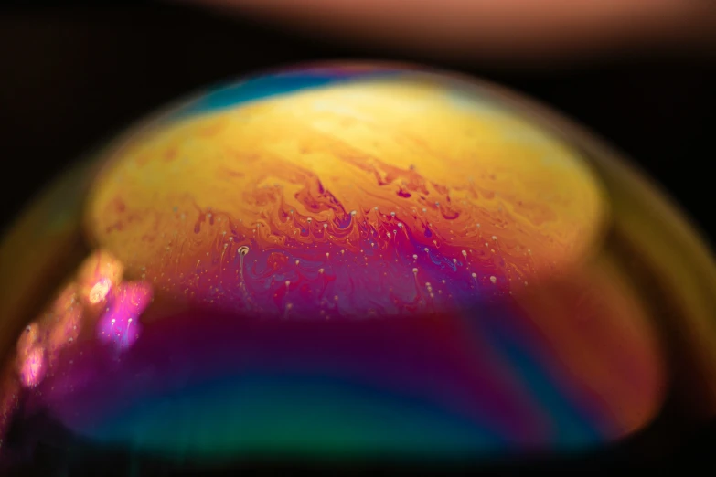 a close up image of the color on a rainbow glass object