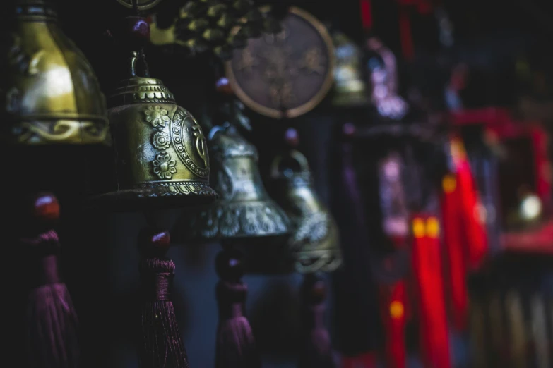 bells on display for purchase in a store