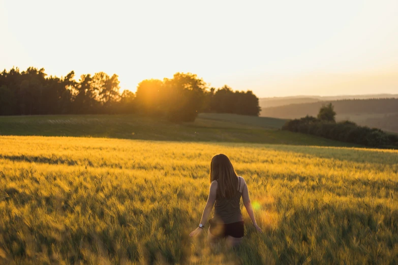 a person in a field with a backpack