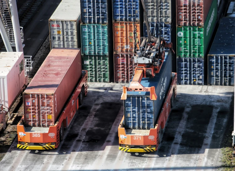 shipping containers are shown sitting in the middle of the ground