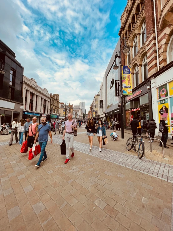 people walking down a street in a city