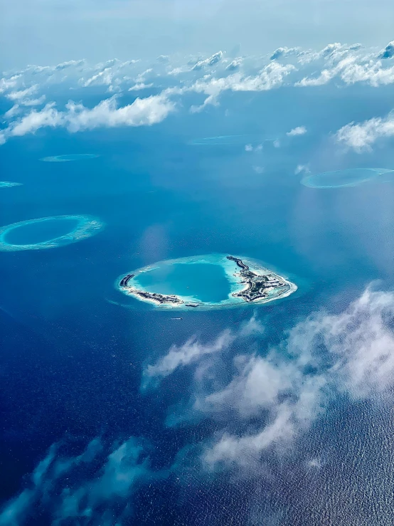an aerial view of a small island in the middle of the ocean