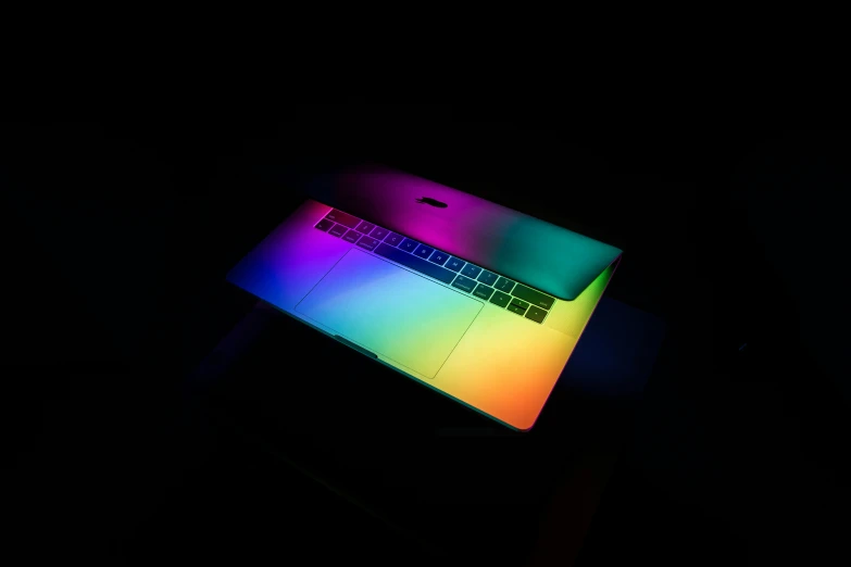 this is a closeup of an illuminated laptop in the dark