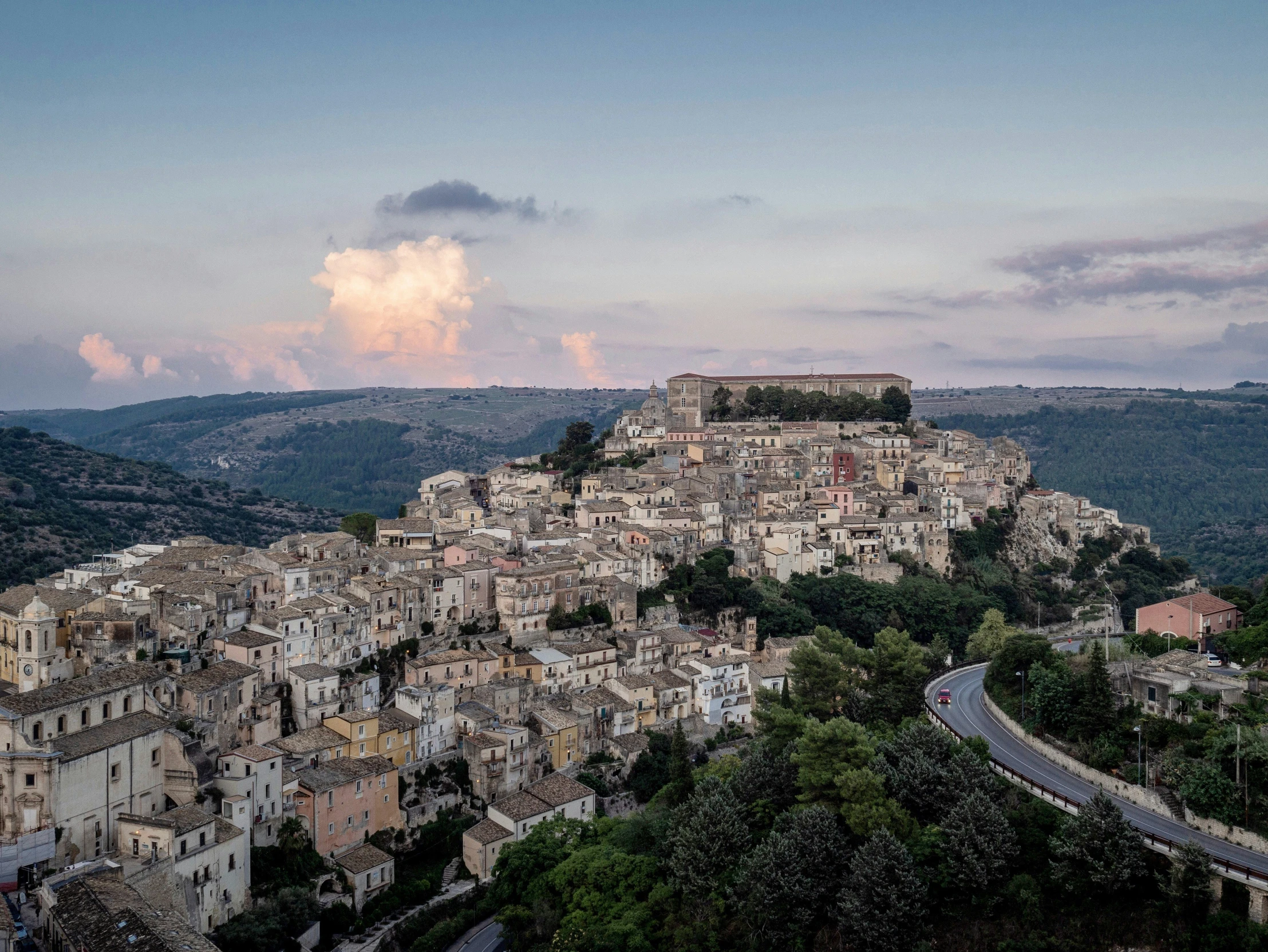 a view of town with a cloud above the buildings