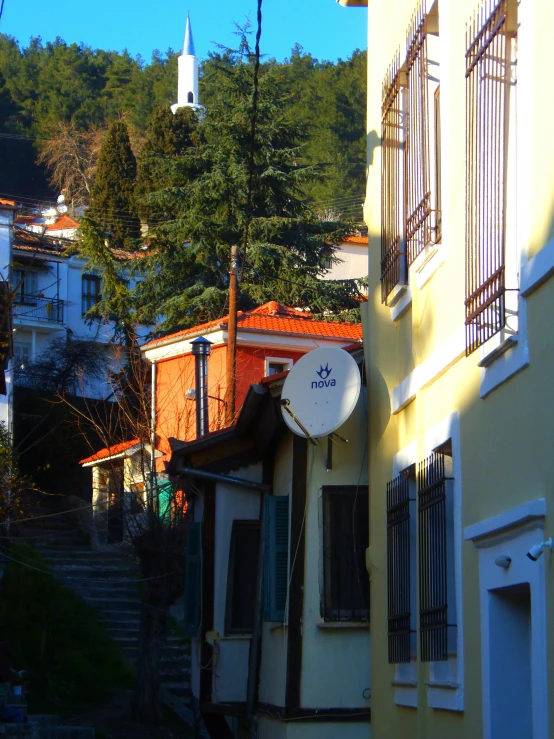 a view from a nearby alley way of an old neighborhood