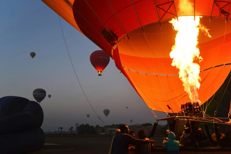 a bunch of  air balloons are in the sky