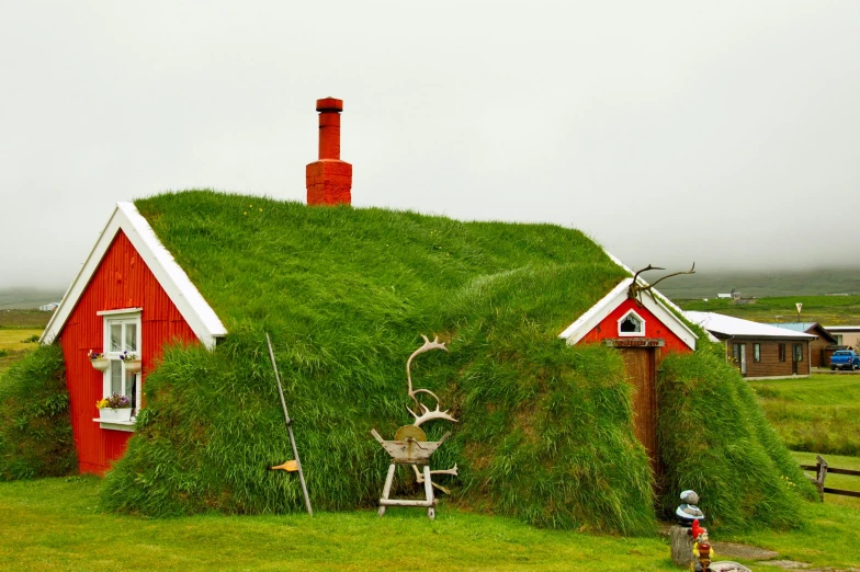 an image of a grass house on the hill