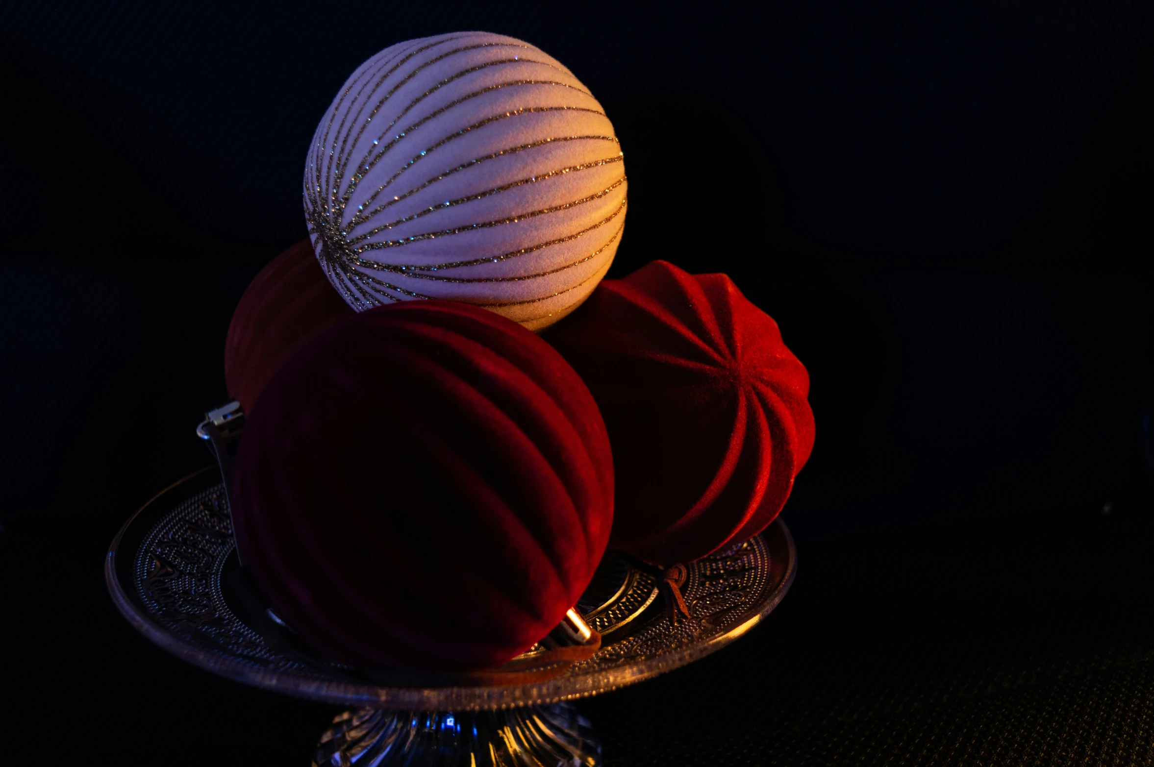 three pieces of fruit placed on a table