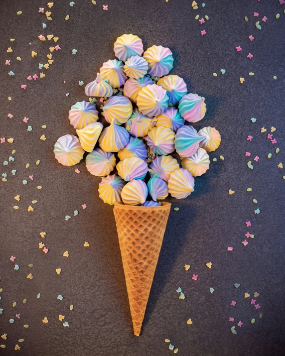 a cone filled with balls sitting next to a table