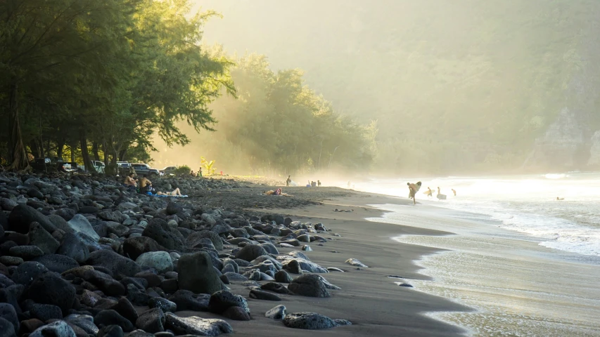 an island line that has many people and lots of rocks