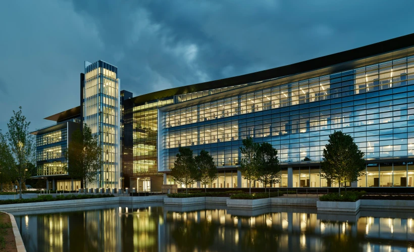 a building sitting in the middle of a river filled with water